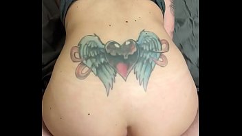 Tattooed brunette fucks