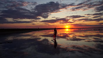 Pink Sunset And Mature Woman thumbnail