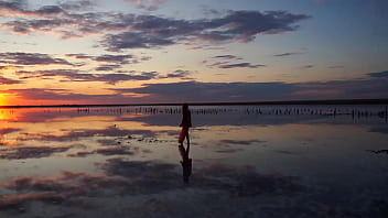 Pink sunset and mature woman Pink sunset and mature woman