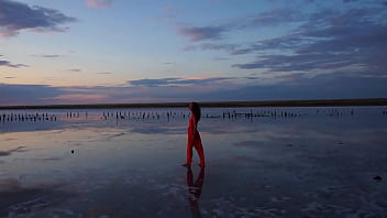 Pink sunset and mature woman