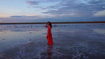 Pink sunset and mature woman