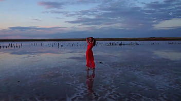 Pink sunset and mature woman