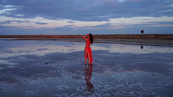 Pink sunset and mature woman