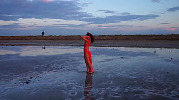 Pink sunset and mature woman