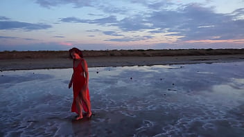 Pink sunset and mature woman