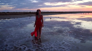 Pink sunset and mature woman