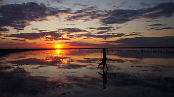 Pink sunset and mature woman Pink sunset and mature woman
