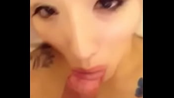 Hot asian girl with tattoo giving blowjob
