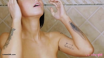 Striking brunette beauty enjoys a sensual bath