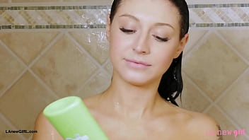 Striking brunette beauty enjoys a sensual bath