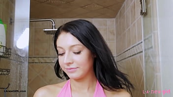 Striking brunette beauty enjoys a sensual bath