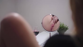 Masturbating in front of mirror