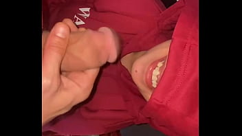 A cock in the mouth of a hooded milf