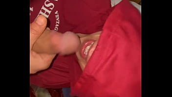 A cock in the mouth of a hooded milf