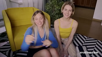 Lesbians play with a dildo for the camera