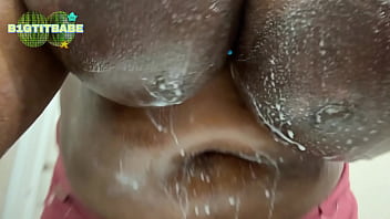 Big wet black tits washing sprinkles off