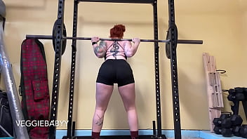 Strong woman lifts weights in spandex shorts veggiebabyy