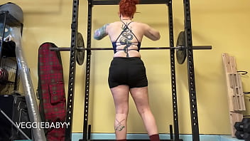 Strong woman lifts weights in spandex shorts veggiebabyy