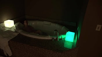 Bbw pleases herself in a big jacuzzi at night