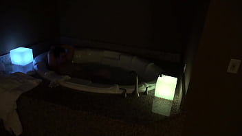 Bbw pleases herself in a big jacuzzi at night