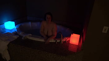 Bbw pleases herself in a big jacuzzi at night
