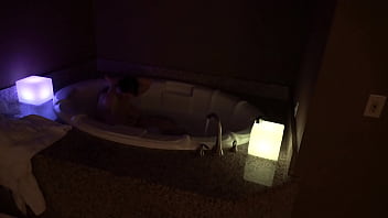 Bbw pleases herself in a big jacuzzi at night