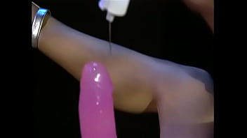 Pretty woman with big tits greedily fucks herself with a big dildo