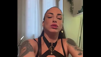 Tattooed brunette in leather lingerie does sexy dance and has an orgasm while masturbating with a dildo