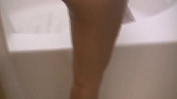 Big titted babe takes a shower