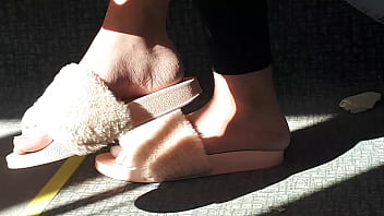 Shoeplay of stupid hot brunette with gorgeous feet wearing slides on train