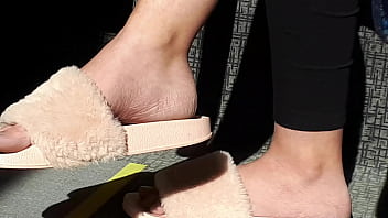 Shoeplay of stupid hot brunette with gorgeous feet wearing slides on train