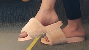 Shoeplay of stupid hot brunette with gorgeous feet wearing slides on train