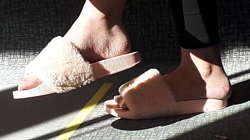 Shoeplay of stupid hot brunette with gorgeous feet wearing slides on train