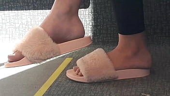 Shoeplay of stupid hot brunette with gorgeous feet wearing slides on train