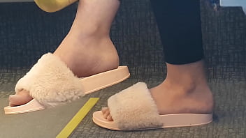 Shoeplay of stupid hot brunette with gorgeous feet wearing slides on train