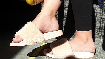 Shoeplay of stupid hot brunette with gorgeous feet wearing slides on train