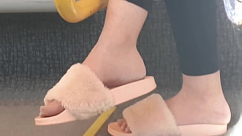 Shoeplay of stupid hot brunette with gorgeous feet wearing slides on train