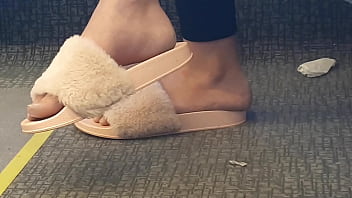 Shoeplay of stupid hot brunette with gorgeous feet wearing slides on train