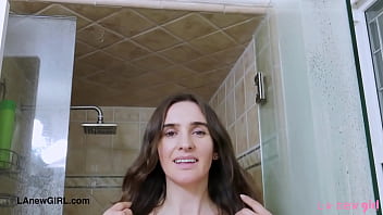 Fresh faced brunette enjoys a sensual bath