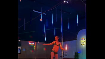 Destiny mae dancing and playing with fire on stage at the strip club
