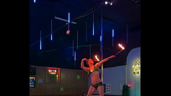 Destiny mae dancing and playing with fire on stage at the strip club