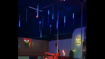 Destiny mae dancing and playing with fire on stage at the strip club