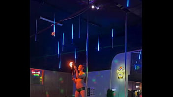 Destiny mae dancing and playing with fire on stage at the strip club