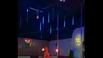 Destiny mae dancing and playing with fire on stage at the strip club