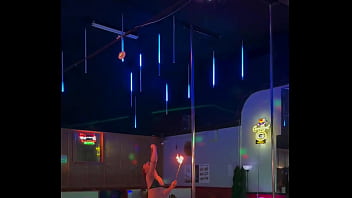 Destiny mae dancing and playing with fire on stage at the strip club