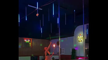 Destiny mae dancing and playing with fire on stage at the strip club