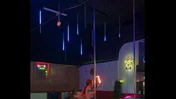 Destiny mae dancing and playing with fire on stage at the strip club