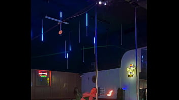 Destiny mae dancing and playing with fire on stage at the strip club