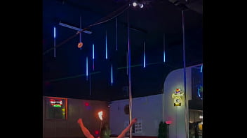 Destiny mae dancing and playing with fire on stage at the strip club