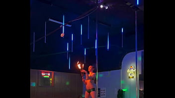 Destiny mae dancing and playing with fire on stage at the strip club